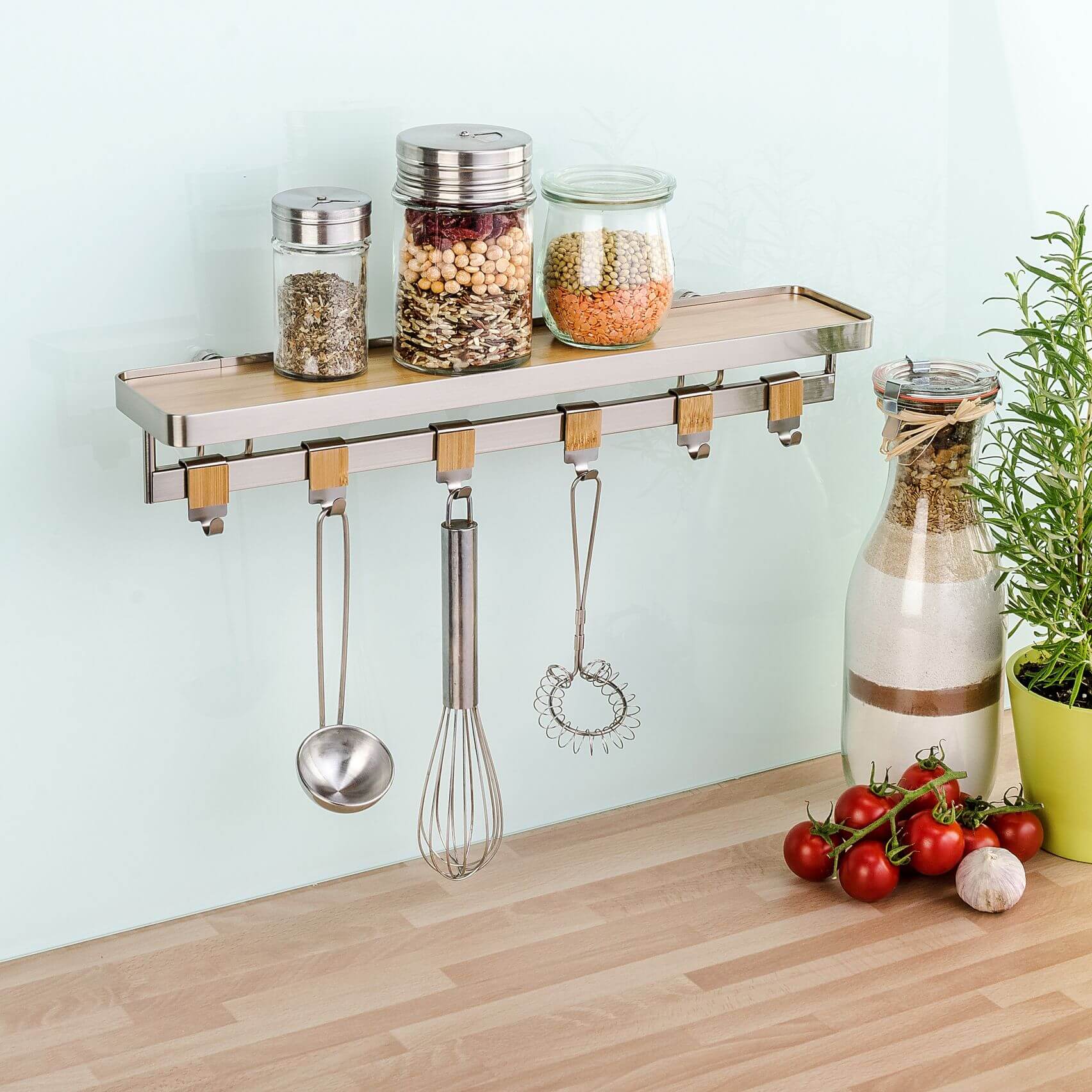 Spice jars sitting on a Premium Spice Rack Bamboo & Steel