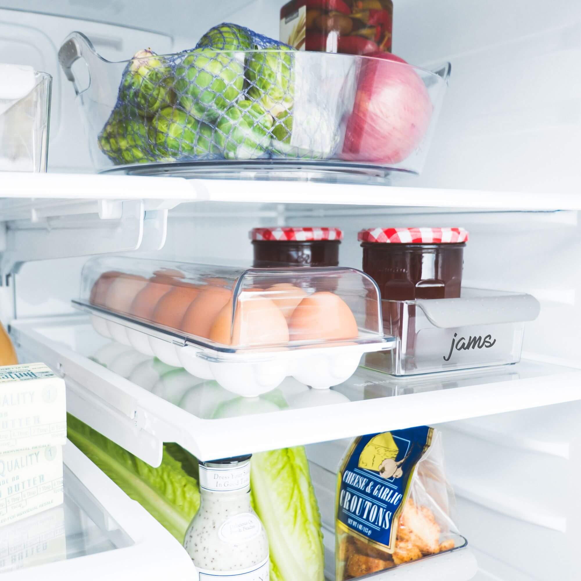 Madesmart turntable, egg tray and containers on fridge shelves