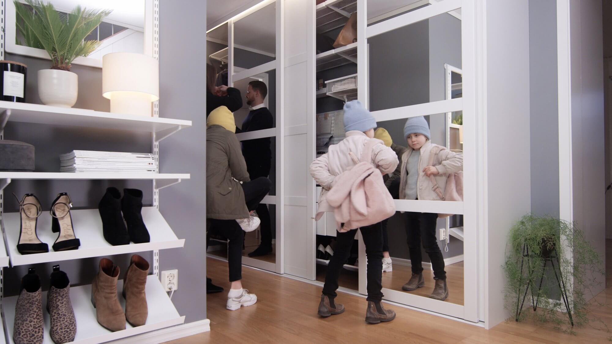 Elfa shelving used in a hallway for shoe storage