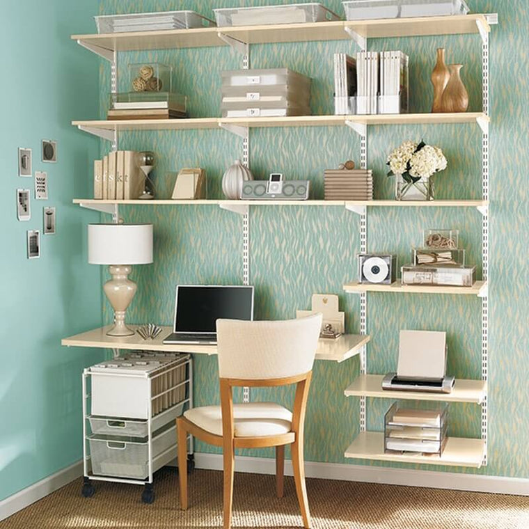 A White Elfa Freestanding Drawer Kit with Mesh Drawers under an office desk 