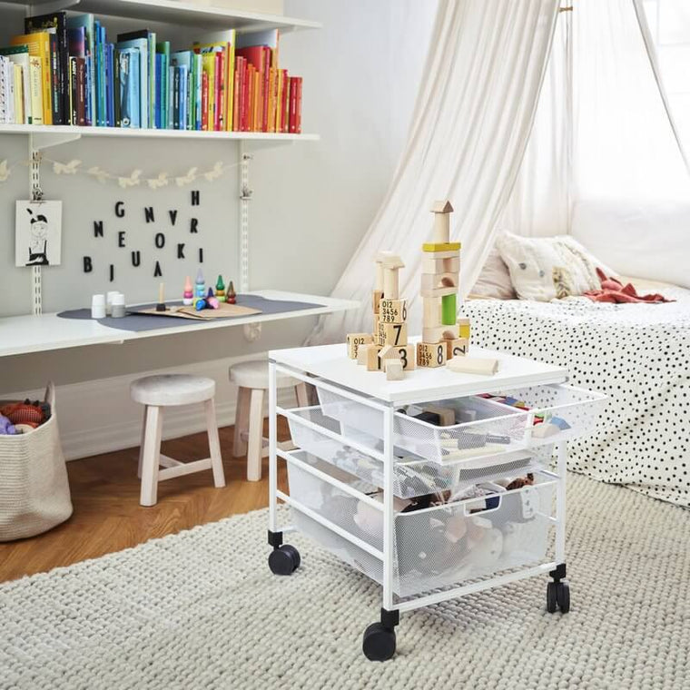 A White Elfa Freestanding Drawer Kit with Mesh Drawers installed in a bedroom to store toys